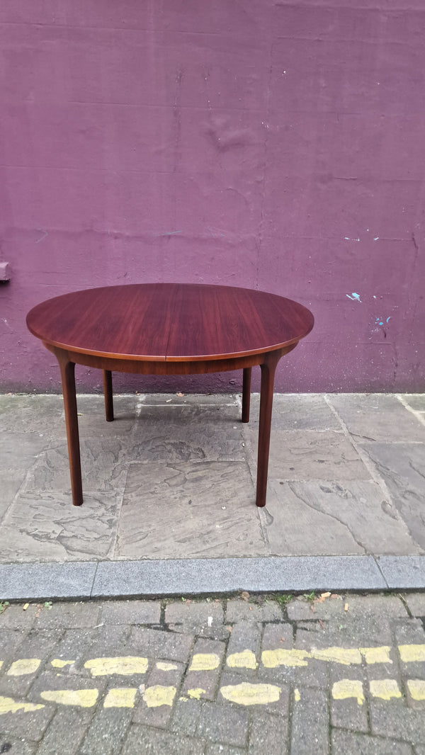 Rosewood round extendable dining table by Mclntosh 1960